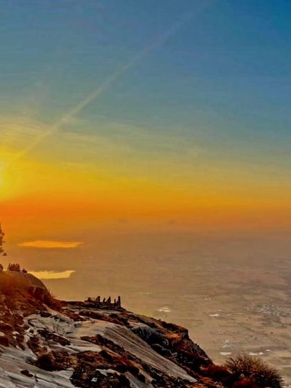 The stunning sunrise view from the top of Skandagiri, with a sea of clouds below. A truly magical sight.