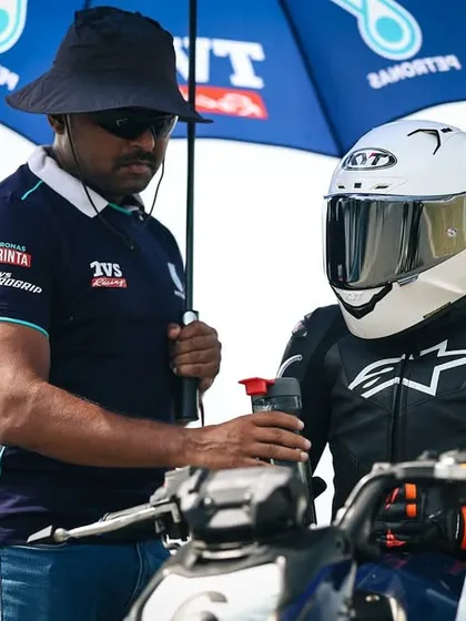 Mentorship is at the core of our program. Here, one of our senior coaches provides direct, one on one feedback to a rider in full race gear, right on the grid before a session. We are with you every step of the way.