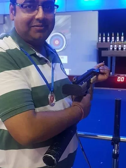 We were proud to award this gentleman a medal for his perfect 10 out of 10 score. Here he is holding one of our competition-style air rifles, ready for his next challenge.