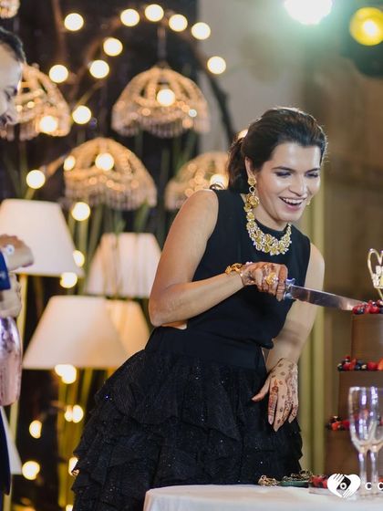 The pure joy of cutting the wedding cake. I love seeing my creations become part of such happy memories. This couple chose a three-tiered chocolate cake decorated with fresh berries.