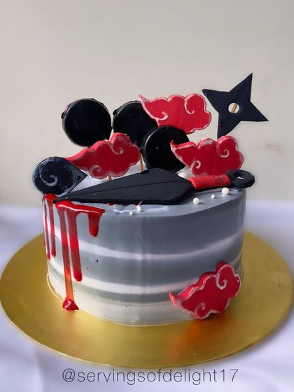 An anime-themed cake for a true fan. This design features iconic symbols from the Naruto series, including the Akatsuki cloud and a kunai knife, with a dramatic red drip.