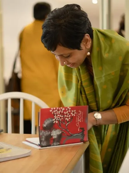 An attendee looks through one of the published anthologies at our event.