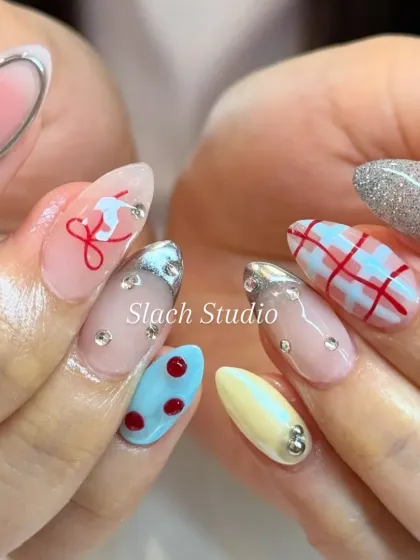 This is how we bring your personality to your fingertips. I created this custom nail art set on almond extensions, combining multiple trends like hand-painted plaid, 3D silver chrome details, delicate line art, and full coverage glitter for a truly one of a kind look.