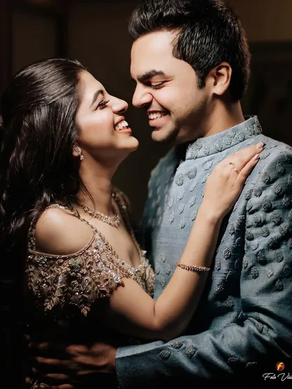 A close-up filled with laughter, this image captures the pure happiness and chemistry between the couple during their engagement celebration.