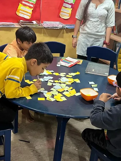 A fun and challenging activity during spring camp. The children are working on a puzzle, which helps with problem-solving and teamwork.