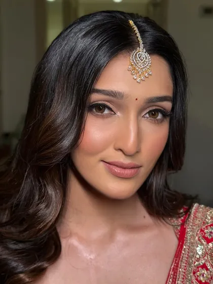 An intimate close-up on the face. You can see the clean lines of the eyeliner and the soft, skin-like finish of the foundation, key elements of my modern bridal style.