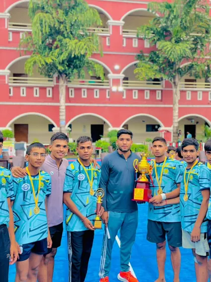 Posing with the winning trophy and some of my champion players after the CBSE cluster tournament.