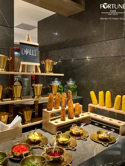 Our "Challi" or corn on the cob station, offering a rustic and flavorful snack perfect for enjoying in the open air of our rooftop.
