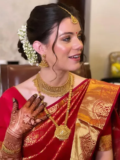 A portrait of the beautiful bride, her traditional hairstyle looking stunning.