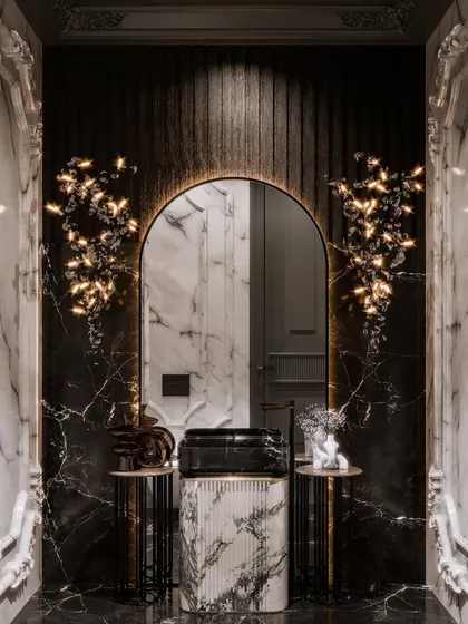 In this rendering of a luxe powder room, the challenge was to create an atmosphere of pure opulence in a compact space. I used advanced material rendering to bring out the dramatic veining of the black marble and the intricate texture of the monolithic sink. The lighting simulation was key, with sculptural fixtures casting an enchanting glow that highlights the contrast between classical moldings and modern forms.