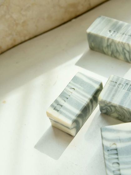 'Minty Breeze' bars catching the light, highlighting their smooth texture.