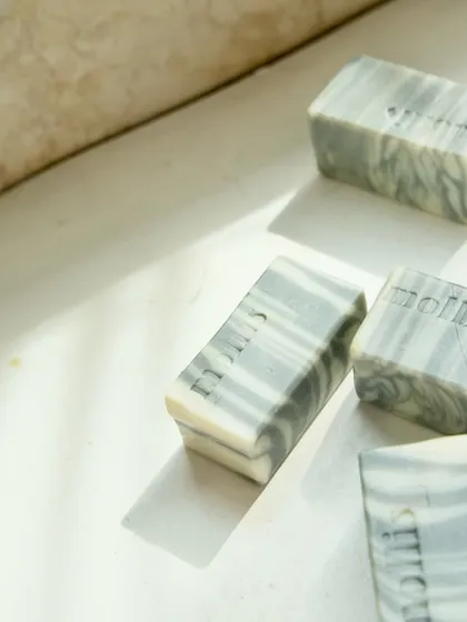 'Minty Breeze' bars catching the light, highlighting their smooth texture.