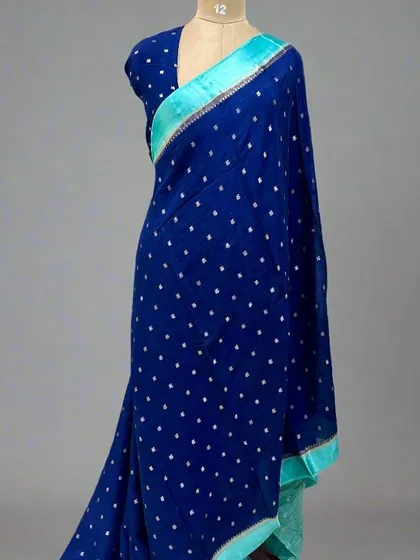 A royal blue Chinnon saree with a contrasting sky blue satin border.