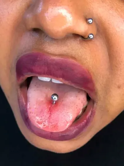 For those looking for a bolder style, here is a combination of a fresh tongue piercing and a healed septum piercing. I am experienced in a wide range of advanced body piercings.