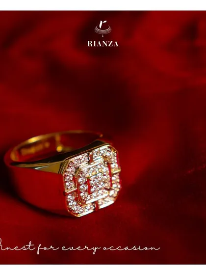 This 18kt yellow gold and diamond ring is a statement piece for a man. The brilliant-cut diamonds are set in a traditional, substantial design perfect for an engagement or special occasion.