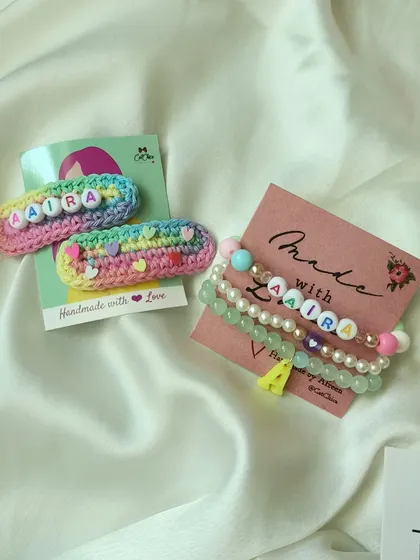 Another beautiful custom set featuring our rainbow name clips and a matching beaded bracelet for 'Aaira'. The combination of crochet and pearl-style beads is just lovely.