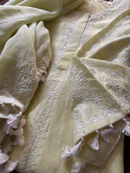 Another detail shot of the sleeve, highlighting the craftsmanship of the embroidery and tassel work.