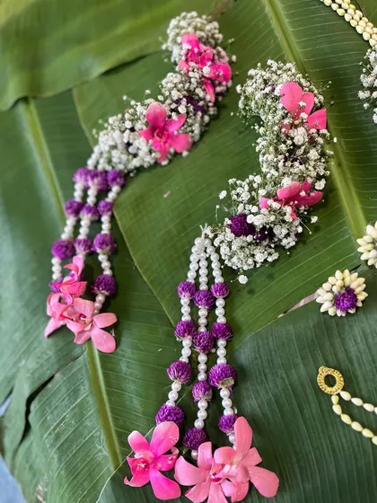 Detailed view of the hath phool from a pink and purple floral set. Notice the combination of orchid petals and small buds, a technique I teach for creating unique textures.