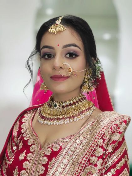 A final portrait of this bride, showcasing the complete look with jewellery and dupatta. The makeup is perfectly balanced for a stunning result.