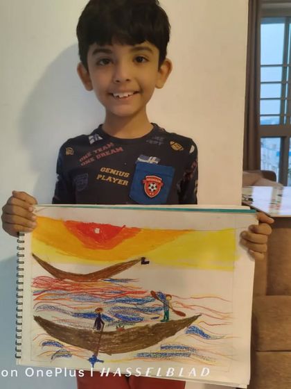 Divyank, a 2nd standard student, drew this peaceful scene of boats on the water at sunset. His use of oil pastels creates a beautiful, warm glow in the sky.