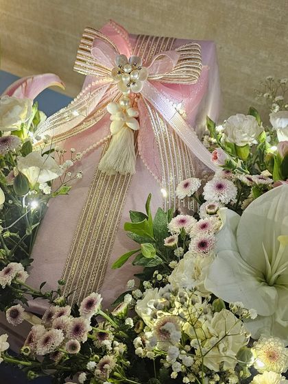 Here you can see the intricate details of the shell tassel and pearl-studded bow. It’s these small, thoughtful touches that make a wedding trousseau from Wrap Love Repeat so special and memorable.