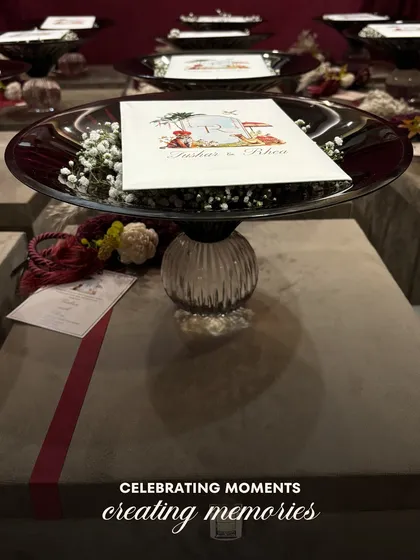 "Celebrating moments, creating memories." This image captures the essence of our wedding gifting philosophy, with our Crimson Crystal Bowl elegantly presented on top of a beautifully wrapped gift box.