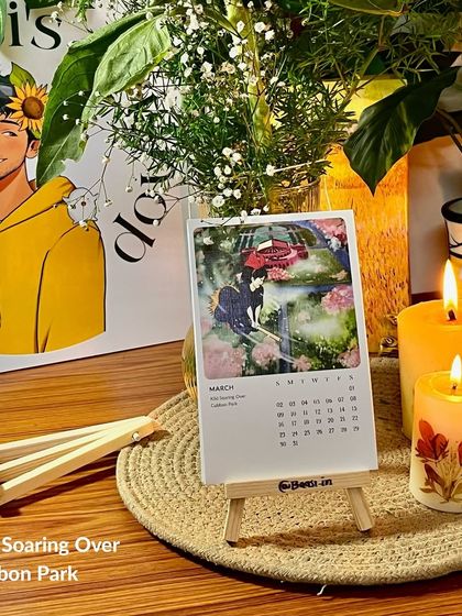 The March page, 'Kiki Soaring Over Cubbon Park', on its easel. This setup shows how the calendar can be a lovely piece of home decor.