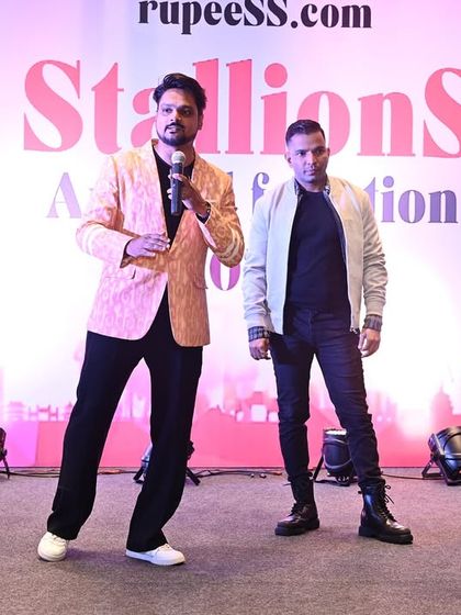 On stage with a guest, getting ready for an interactive segment. I am always prepared to bring employees on stage for games and fun, making the event more engaging.