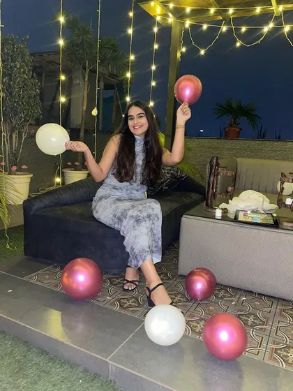 A guest enjoying the party. The rooftop offers plenty of comfortable seating and photo-worthy corners, ensuring everyone has a great time celebrating the bride-to-be.