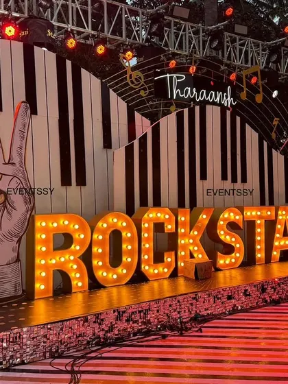 For a high-energy 5th birthday, I designed this full rockstar concert stage. It features large marquee letters, a custom piano key backdrop, and stage lighting to make the birthday boy feel like a true star.