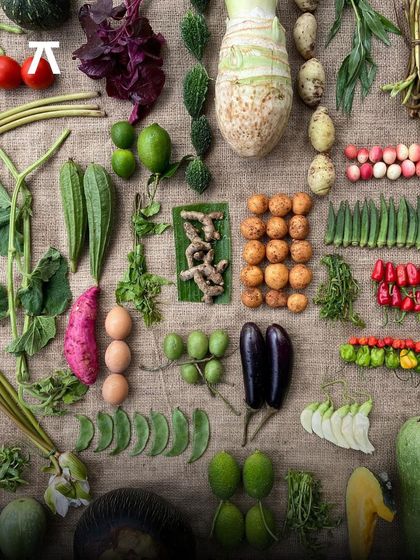 A vibrant spread of fresh, local Bengali produce. This image represents the "Bajaar to Table" philosophy of Sienna, Calcutta, where the menu is defined by what's available in the region's bustling local markets.