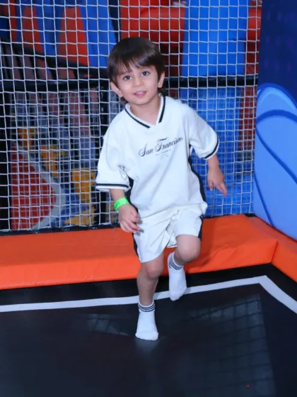 That feeling of weightlessness! A young boy enjoys a moment of pure fun, bouncing high on our professional-grade trampolines. It's the perfect activity for energetic kids.
