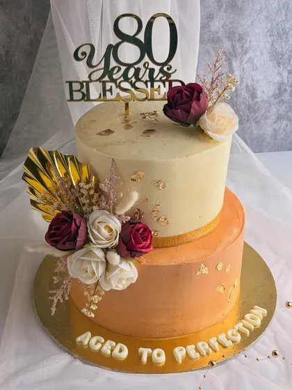 Celebrating eight decades is a monumental milestone. This "Aged to Perfection" cake was designed for an 80th birthday, combining elegant florals with warm, rich colors. It was an honor to create a cake that reflects a life full of wisdom, grace, and blessings.