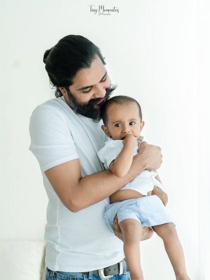 A father's gentle embrace. This portrait highlights the tender, protective bond between a dad and his baby.