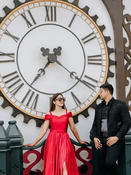 A timeless pre-wedding photo featuring our elegant red gown. The classic silhouette and bold color make for an unforgettable portrait.