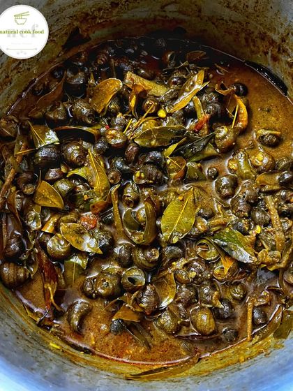 Tharoi Thongba, a traditional Manipuri snail curry, for those who want to try something truly authentic.