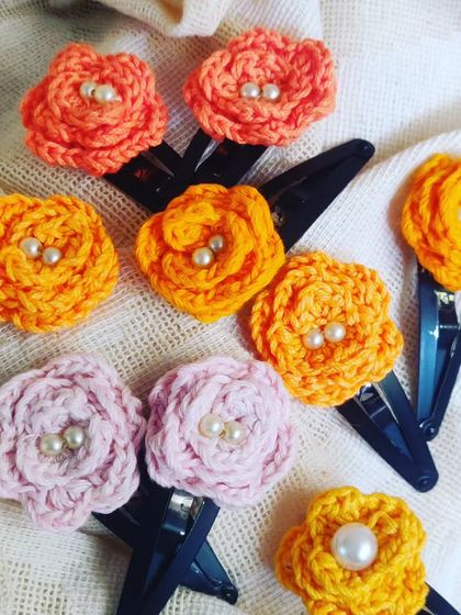 The full set of my floral hair clips, showcasing the different colors and styles. They are available in sets of four.