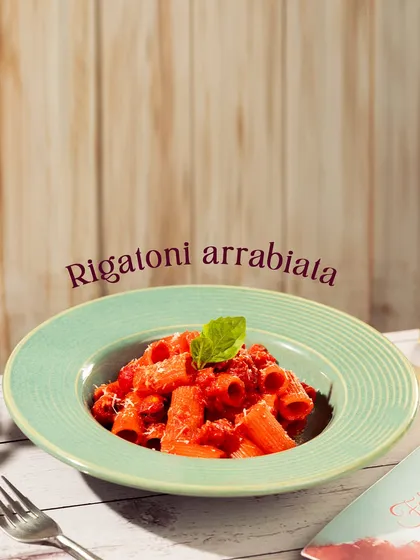 My Rigatoni Arrabbiata is a classic for a reason. The spicy tomato sauce clings perfectly to the large pasta tubes, making every bite a flavor explosion.