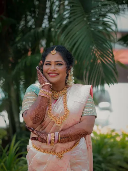 It's a joy to capture the unique beauty of different cultures. This portrait of a South Indian bride showcases her elegance, from the intricate gold temple jewelry to her happy, confident smile, reflecting the richness of her heritage.