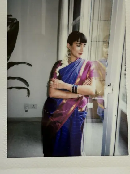 A polaroid taken during my Kanjeevaram saree shoot, capturing a soft, reflective moment by the window.