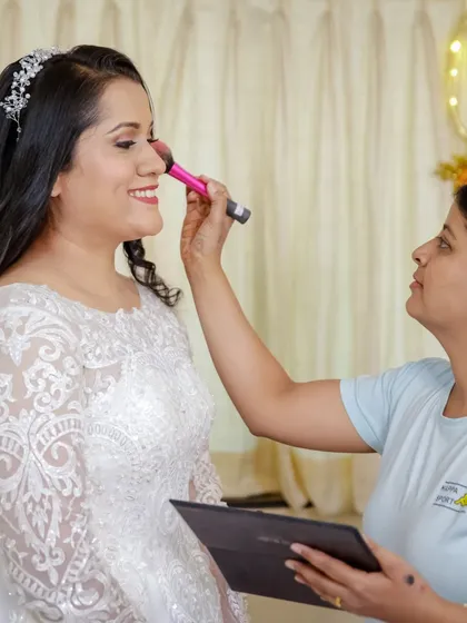 A candid shot of me applying blush to the bride. My goal is always to create a calm and happy environment, making the getting-ready process a memorable part of the day.