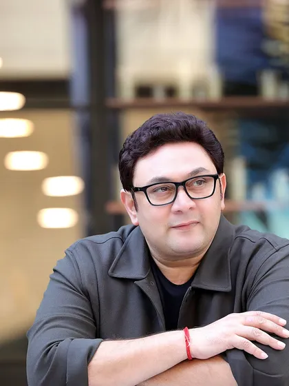 A candid, relaxed portrait of Rajesh Kumar, famous for his role in 'Sarabhai vs Sarabhai'. This shot captures a more natural and approachable side, essential for showing an actor's range beyond their iconic characters.