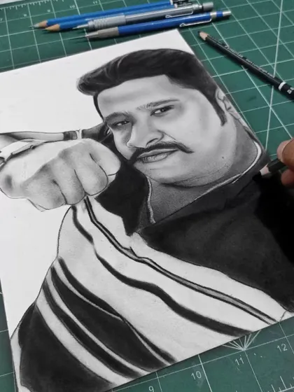 The final stages of a charcoal portrait. At this point, I'm adding the last details and cleaning up the edges before the piece is complete and ready for the client.