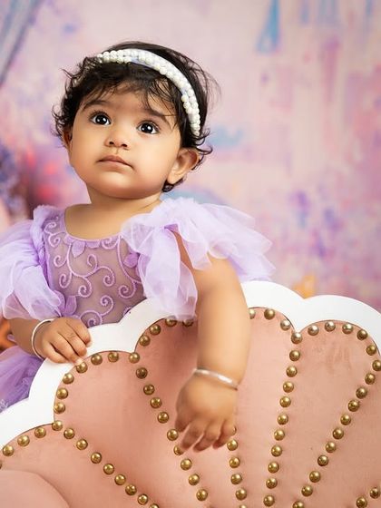 A thoughtful pose from the birthday girl in her princess setup. I aim for a variety of shots, from big smiles to quiet, contemplative moments.
