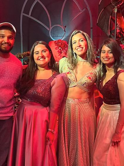 My team and I with the bride after a fantastic sangeet night. Seeing our clients happy is the ultimate reward.