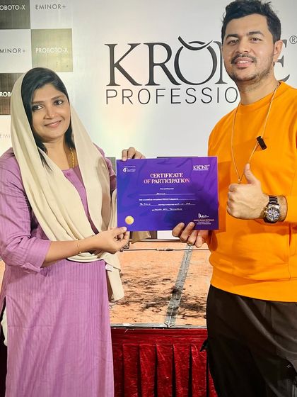 Presenting a certificate of participation at my Kerala seminar. Recognizing the dedication of fellow stylists is one of the most rewarding parts of my work as an educator.