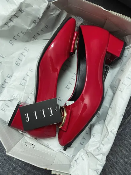 The footwear game is so important. Red is a color that's here to stay, and these classic red ballerinas are proof. They add that perfect touch of chic to any look, proving that red is always a good idea.