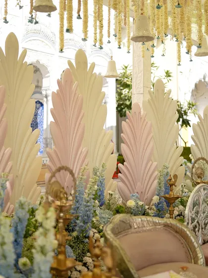 Another angle of the mandap, showing the layers of florals and the hanging bell installation.