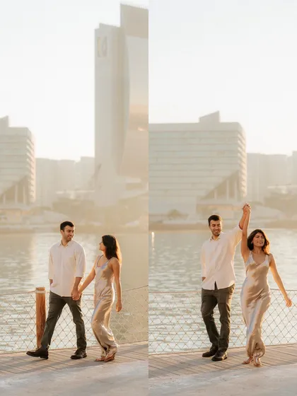 A diptych showing a couple walking hand-in-hand along a pier in Dubai. The hazy, sunlit cityscape provides a stunning backdrop for their pre-wedding photos.