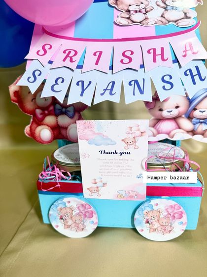 Double the joy! A close-up of our twin celebration hamper for Srisha and Sevansh, featuring a personalized name banner.